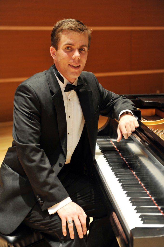 Daniel sitting at the Steinway D in Wilson Hall
